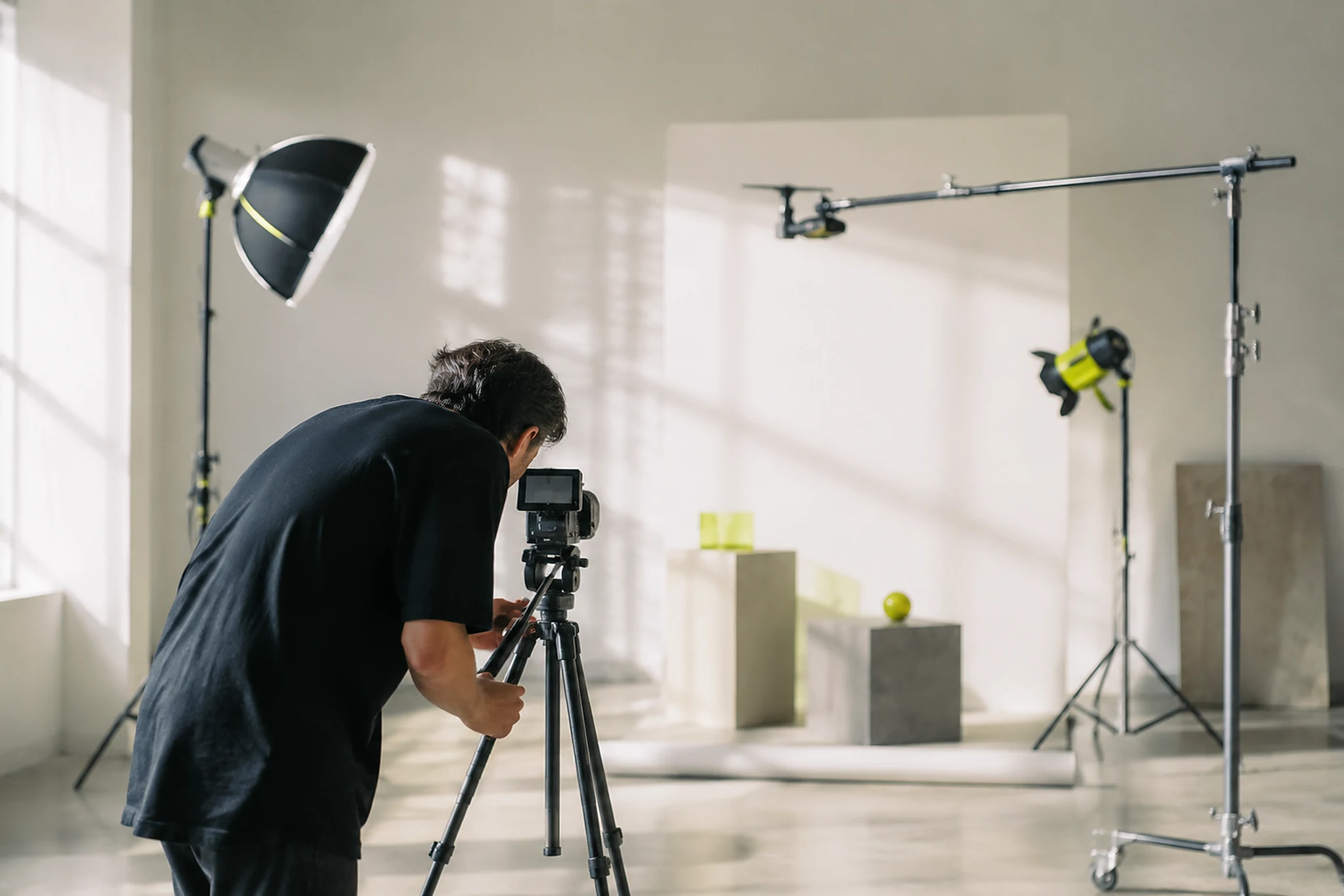 Camera and lighting set up on a small studio production floor